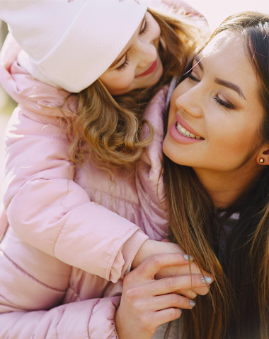 Happy surrogate mother enjoying time outdoors